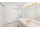 Bathroom vanity features bright lighting, a large mirror, and plenty of storage space at 30 Turner St # 401, Clearwater, FL 33756