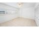 Inviting bedroom with tile floors, natural lighting, and a ceiling fan at 30 Turner St # 401, Clearwater, FL 33756