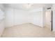 Bright bedroom features a ceiling fan, tiled floors and a closet at 30 Turner St # 401, Clearwater, FL 33756