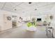 Spacious common room with seating areas, tables, and a partial view of the kitchen, perfect for gatherings at 30 Turner St # 401, Clearwater, FL 33756