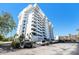 Angled view of the condo building highlighting multiple floors and surrounding parking area at 30 Turner St # 401, Clearwater, FL 33756