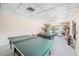 Bright game room featuring a ping pong and pool table, offering residents recreational fun and activities at 30 Turner St # 401, Clearwater, FL 33756