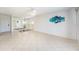 Open living area with tile flooring, mirrored wall, and contemporary decor at 30 Turner St # 401, Clearwater, FL 33756