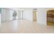 Inviting living area with tile floor, ceiling fan, and balcony access at 30 Turner St # 401, Clearwater, FL 33756