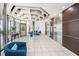 The modern building lobby has an interesting geometric ceiling, with comfortable seating, and elevator access at 30 Turner St # 401, Clearwater, FL 33756