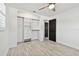 Bedroom with wood-look tile floors, ceiling fan and closet at 3208 San Carlos St, Clearwater, FL 33759