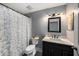 Stylish bathroom with a modern vanity and shower featuring decorative curtain at 35502 Welby Ct, Zephyrhills, FL 33541