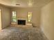 Living Room with fireplace and large windows, ready for renovation at 851 Mandalay Ave, Clearwater Beach, FL 33767