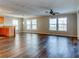 Open concept living space with wood-look floors and kitchen island at 8676 Fantasia Park Way, Riverview, FL 33578