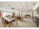 Community room with multiple tables and seating for residents at 30 Turner St # 401, Clearwater, FL 33756