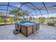 Hot tub on patio with screened enclosure at 11339 Tayport Loop, New Port Richey, FL 34654