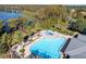 Relaxing community pool with a waterslide and lake views at 11339 Tayport Loop, New Port Richey, FL 34654