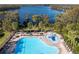 Enjoy resort-style living with this community pool and lake views at 11339 Tayport Loop, New Port Richey, FL 34654
