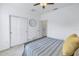 Bedroom with striped bedding and a large closet at 11339 Tayport Loop, New Port Richey, FL 34654
