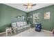 Relaxing Gathering room featuring a leather couch and large window at 11339 Tayport Loop, New Port Richey, FL 34654
