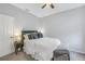 Cozy bedroom with a queen-size bed and gray carpeting at 11339 Tayport Loop, New Port Richey, FL 34654
