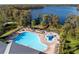 Large community pool with a waterslide and plenty of lounge chairs at 11339 Tayport Loop, New Port Richey, FL 34654
