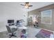 Home office featuring a desk, computer, and ample storage at 11339 Tayport Loop, New Port Richey, FL 34654