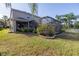 House with a large backyard and screened patio at 11339 Tayport Loop, New Port Richey, FL 34654
