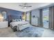 Spacious main bedroom with king bed, and ceiling fan at 11339 Tayport Loop, New Port Richey, FL 34654