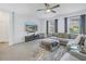 Spacious Gathering room with sectional sofa, large TV, and plenty of natural light at 11339 Tayport Loop, New Port Richey, FL 34654