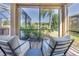 Relaxing patio seating area with lake view at 11339 Tayport Loop, New Port Richey, FL 34654