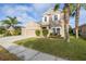 Two-story house with a three-car garage at 11339 Tayport Loop, New Port Richey, FL 34654