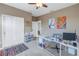 Bright home office with built-in shelving and desk at 11339 Tayport Loop, New Port Richey, FL 34654