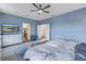 Main bedroom with king bed, attached bath, and walk-in closet at 11339 Tayport Loop, New Port Richey, FL 34654