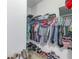 Well-organized walk-in closet with shelving and hanging rods at 11339 Tayport Loop, New Port Richey, FL 34654