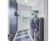 Laundry room with washer, dryer, and window at 11339 Tayport Loop, New Port Richey, FL 34654