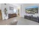 Living room showcases a large TV and modern media console at 11339 Tayport Loop, New Port Richey, FL 34654