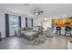 Spacious living room with gray sectional sofa and large TV at 11339 Tayport Loop, New Port Richey, FL 34654