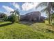 Large backyard with home and screened patio at 11339 Tayport Loop, New Port Richey, FL 34654