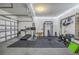 Garage converted into a home gym with equipment at 11339 Tayport Loop, New Port Richey, FL 34654