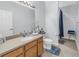 Bathroom with a single sink vanity, toilet, and shower at 11339 Tayport Loop, New Port Richey, FL 34654