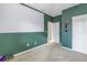 Spacious bedroom with green walls and carpet flooring at 11339 Tayport Loop, New Port Richey, FL 34654