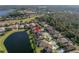 Aerial view of a house near a lake at 11339 Tayport Loop, New Port Richey, FL 34654