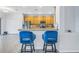 Kitchen features a breakfast bar with blue velvet stools at 11339 Tayport Loop, New Port Richey, FL 34654