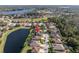 Aerial view of a house near a lake at 11339 Tayport Loop, New Port Richey, FL 34654