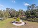 Relaxing community park with picnic tables and benches under shade trees at 11339 Tayport Loop, New Port Richey, FL 34654