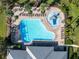 Community pool with a waterslide, plenty of lounge chairs and palm trees at 11339 Tayport Loop, New Port Richey, FL 34654