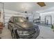 Finished garage with car and home gym setup at 11339 Tayport Loop, New Port Richey, FL 34654