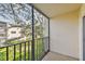 Relaxing screened balcony with treetop views at 820 Virginia St # 202, Dunedin, FL 34698