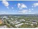 Wide aerial view of condo community and surrounding area at 820 Virginia St # 202, Dunedin, FL 34698