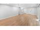 Living room with kitchen pass-through and hardwood floors at 1011 S Moody Ave # 32, Tampa, FL 33629