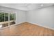 Bright bedroom with wood floors and access to patio at 1011 S Moody Ave # 32, Tampa, FL 33629