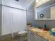 Bathroom with granite countertop and a bathtub at 12501 Ulmerton Rd # 82, Largo, FL 33774