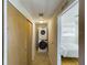 Stackable washer and dryer in a narrow hallway at 12501 Ulmerton Rd # 82, Largo, FL 33774