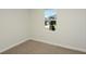 Bright bedroom with carpeted floor and window offering natural light at 14465 Meadow Bird Ave, Riverview, FL 33579